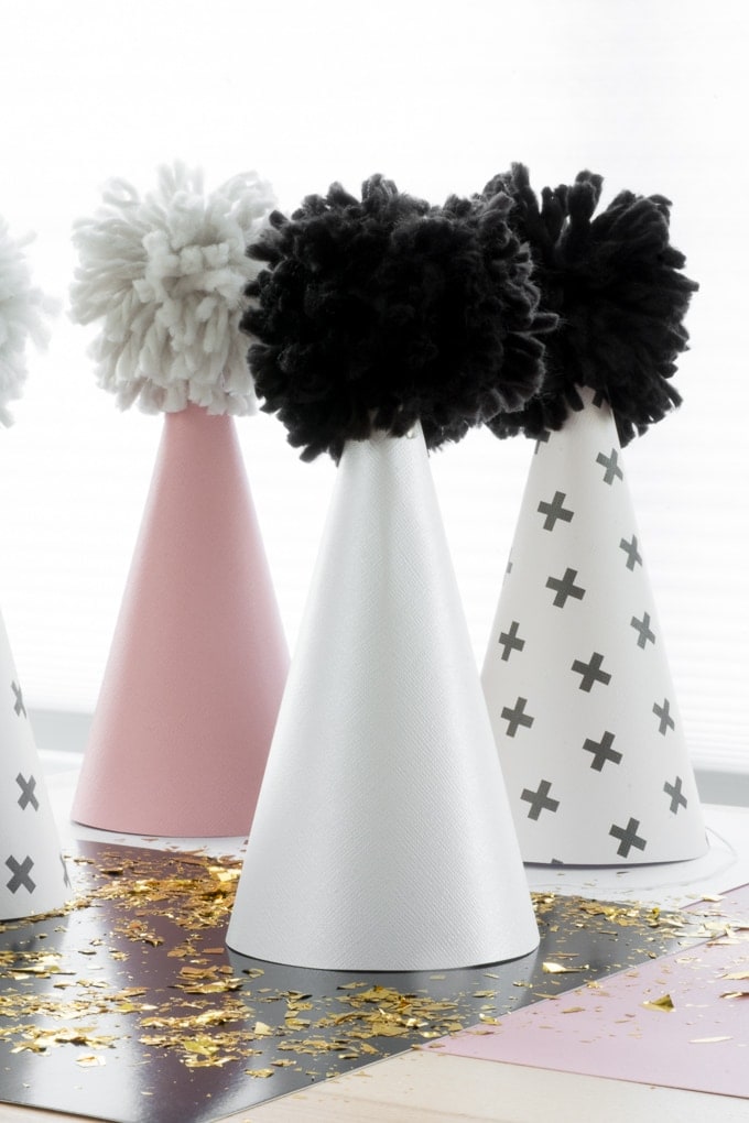DIY scrapbook paper and yarn party hats