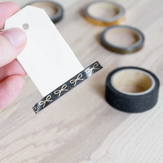 adding tape to the DIY washi tape gift tags