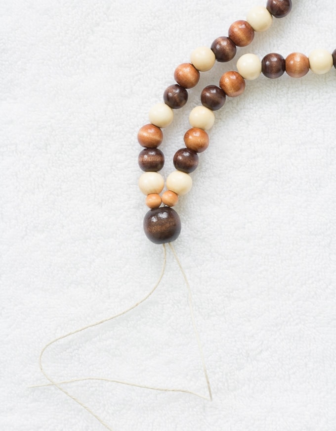 threading wooden beads