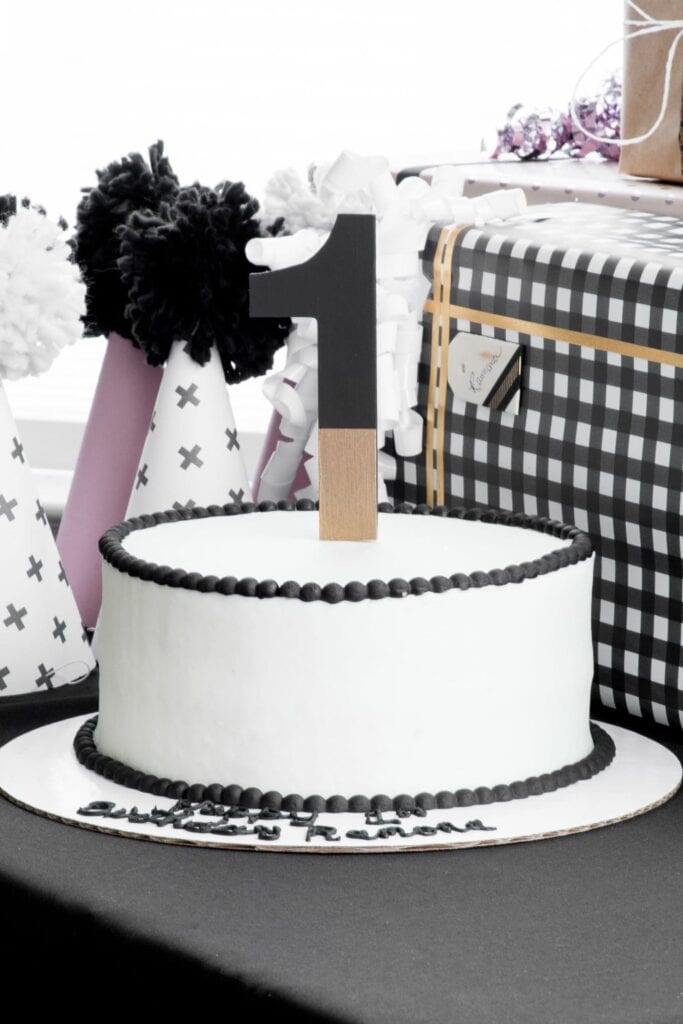 simple DIY Birthday Cake Topper in a black and white cake