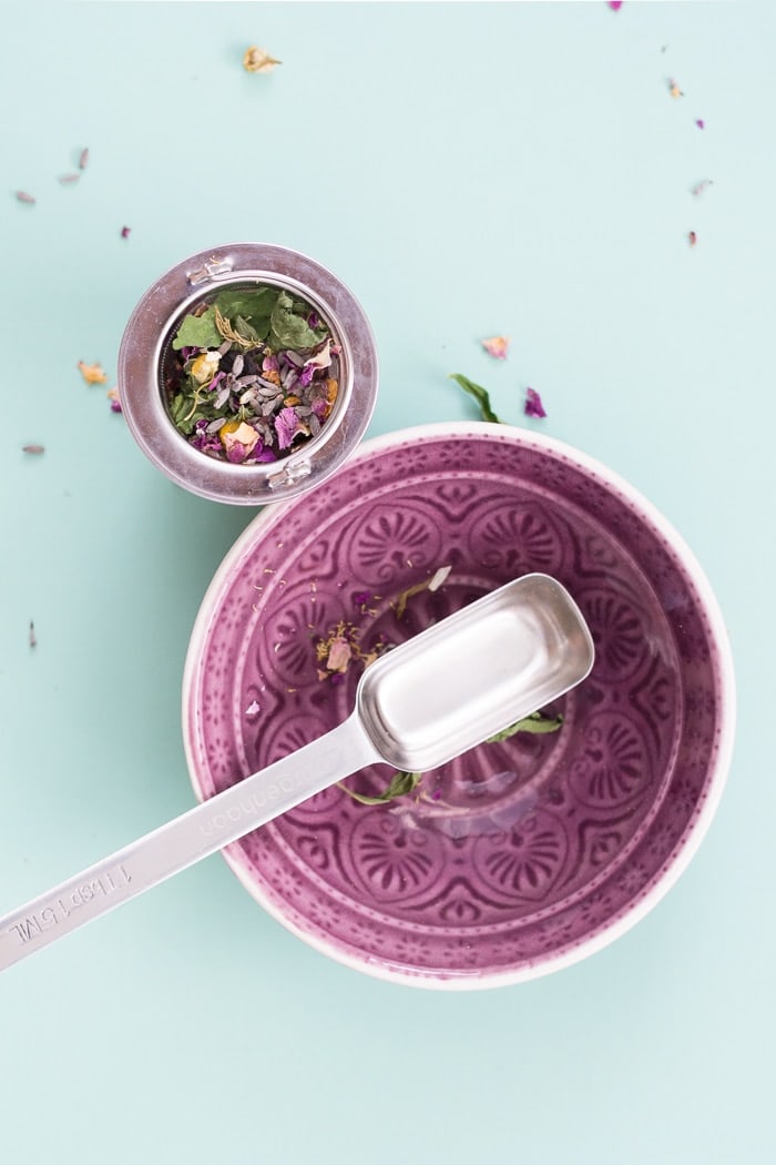 beautiful styled overhead image of a bowl, a spoon, and dried flowers
