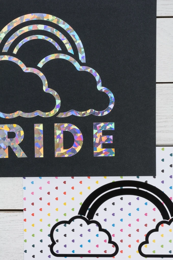 piece of paper that says PRIDE in holographic vinyl with a rainbow