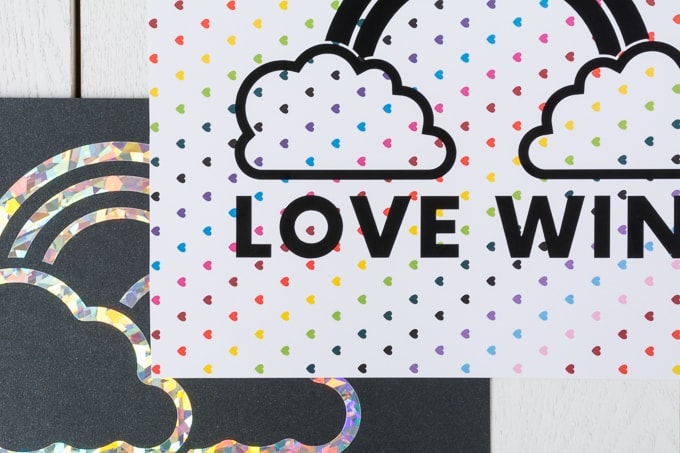piece of paper with rainbow hearts that says love wins