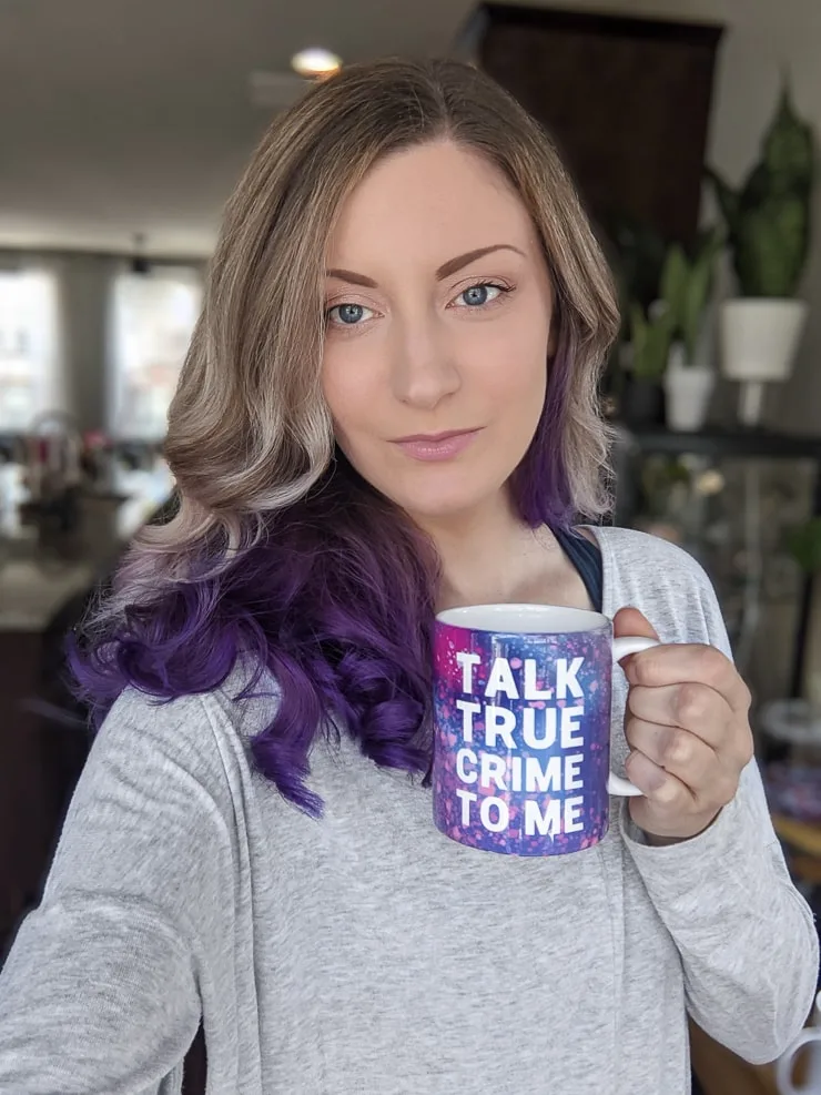 woman with a coffee mug that says talk true crime to me