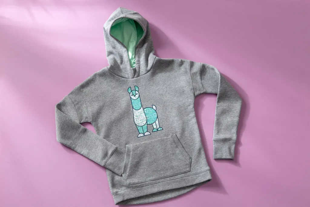 DIY sweatshirt with a llama iron-on figure on it