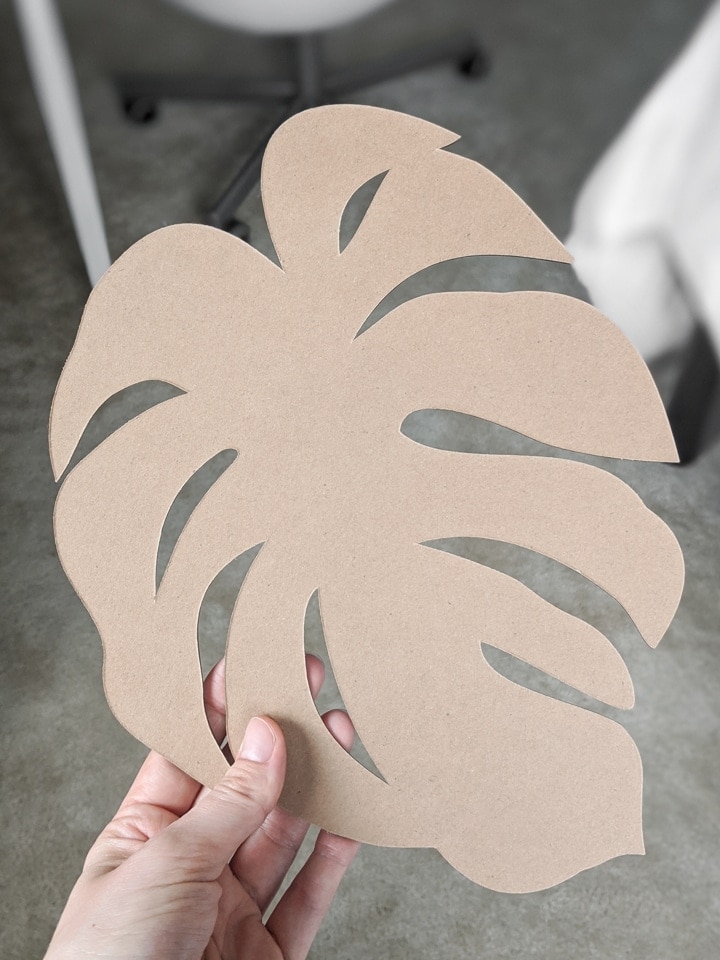 monstera leaf cut out of chipboard on a Cricut Maker using a knife blade