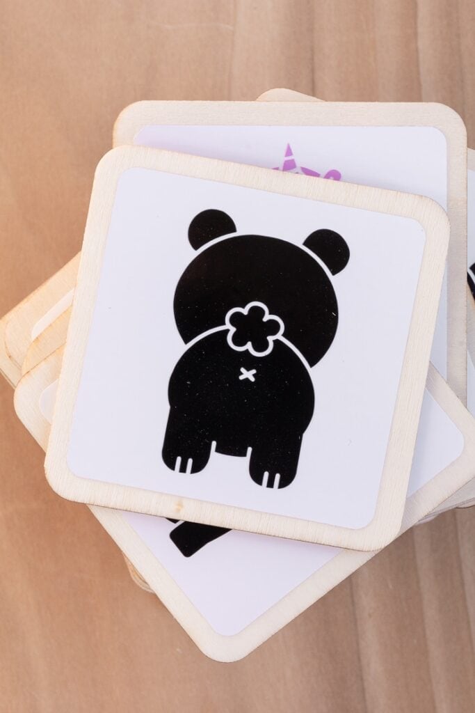 applying the animal vinyl cutouts to the DIY matching game