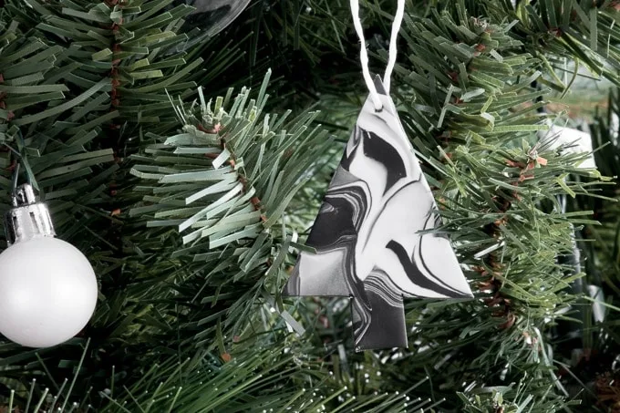 marbled Christmas ornaments using clay hanging on a tree