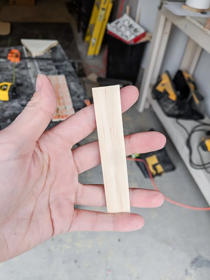 small piece of wood in a hand