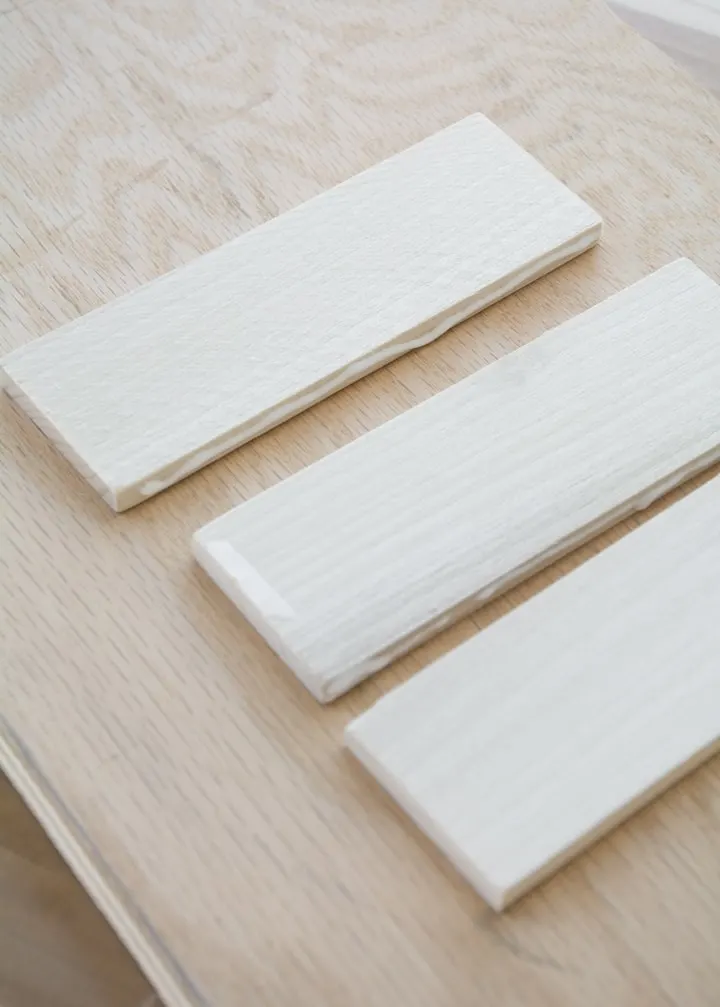 adding wood glue to the edges of each piece of wood
