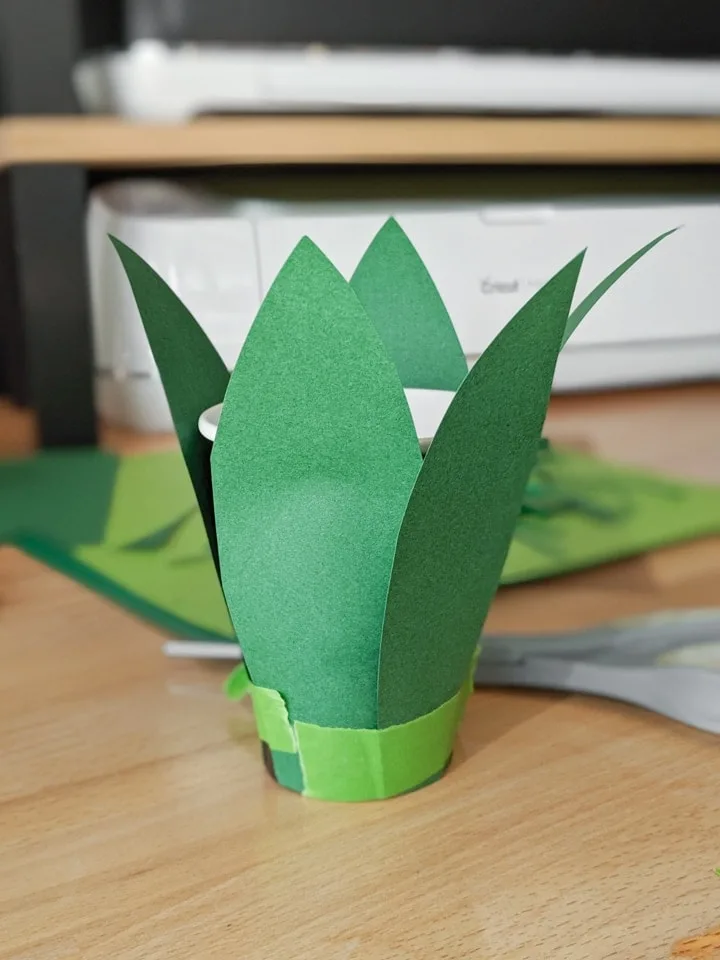 applying the paper pieces to make the pineapple head piece