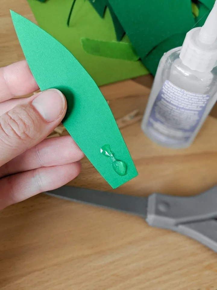 piece of green paper with glue