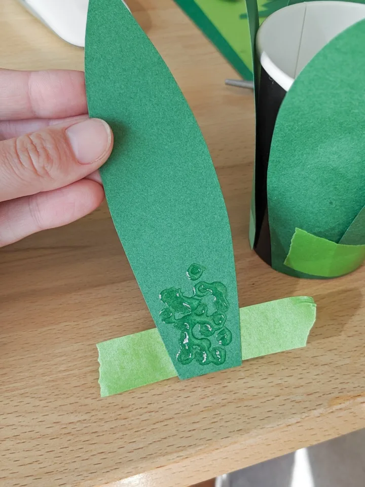 piece of green paper with glue