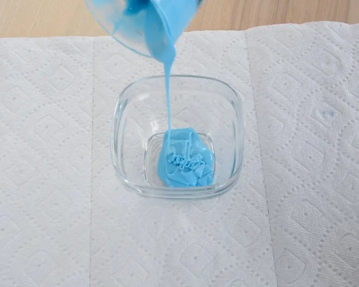 pouring a two-part liquid silicone mixture into a bowl