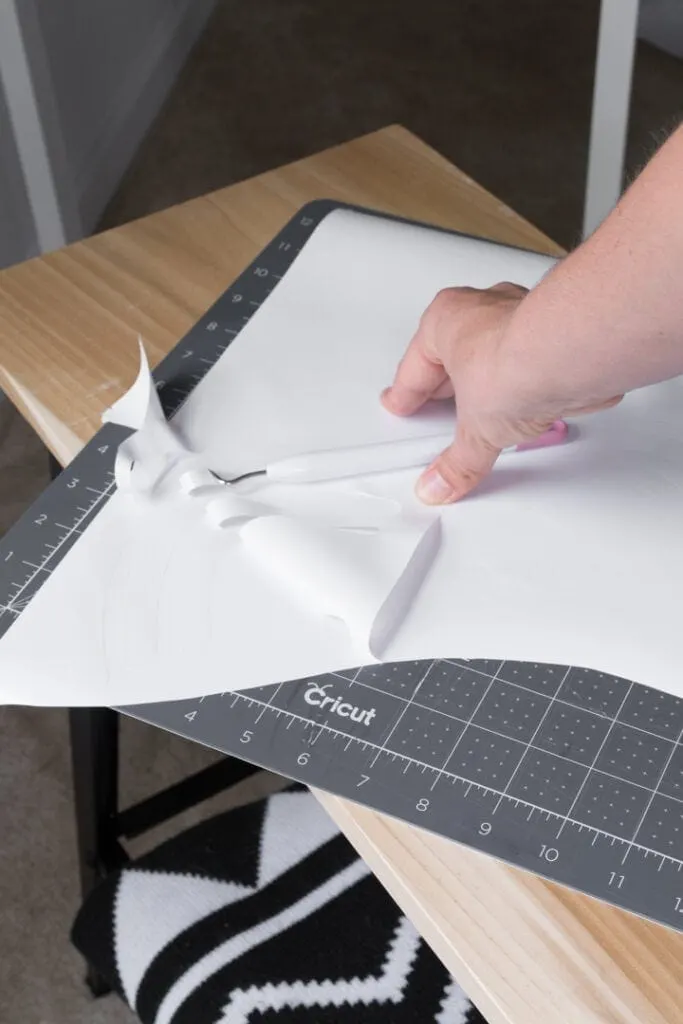 removing negative space after cutting vinyl on a Cricut machine to make DIY wall decals