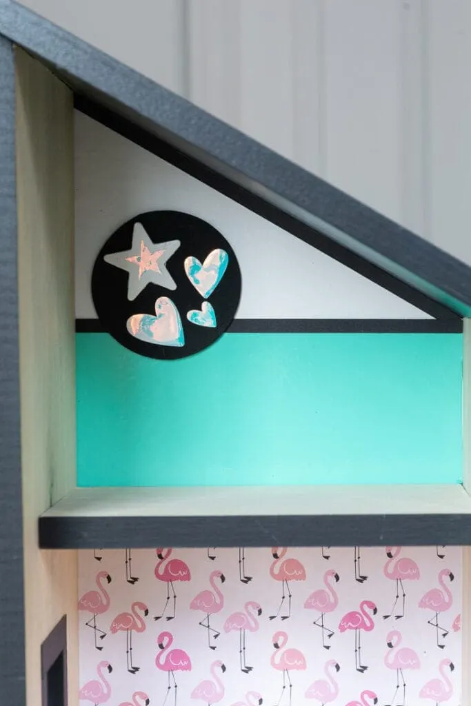 creating dollhouse wall art using a painted wooden circle with adhesive vinyl