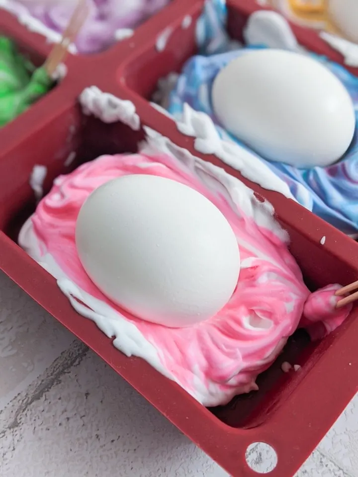 dyeing hardboiled eggs in food coloring and shaving cream