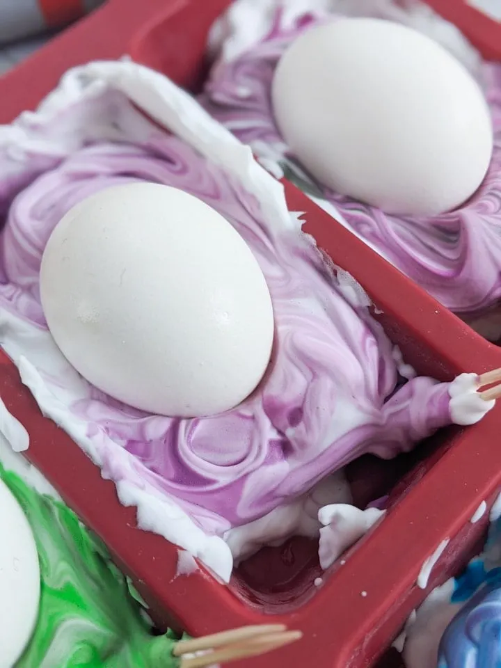 dyeing hardboiled eggs in food coloring and shaving cream