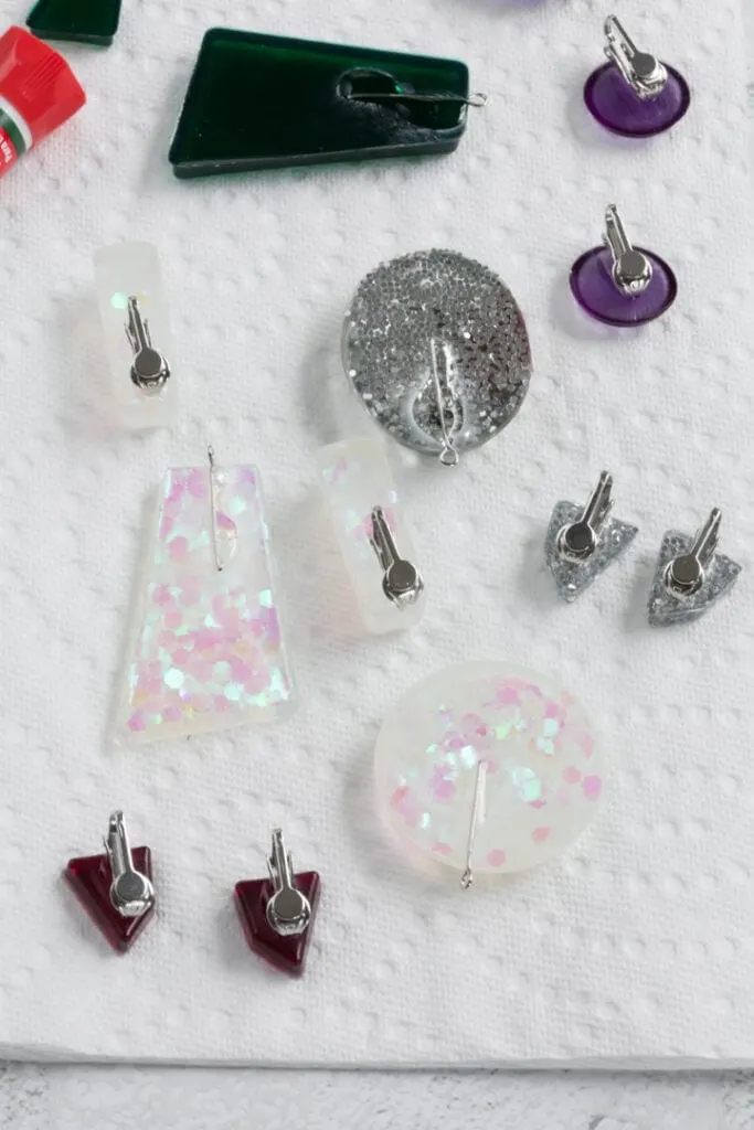 gluing jewelry hardware onto the resin jewelry pieces