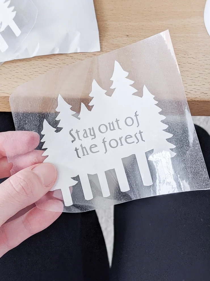 Infusible Ink transfer sheet that says "stay out of the forest"