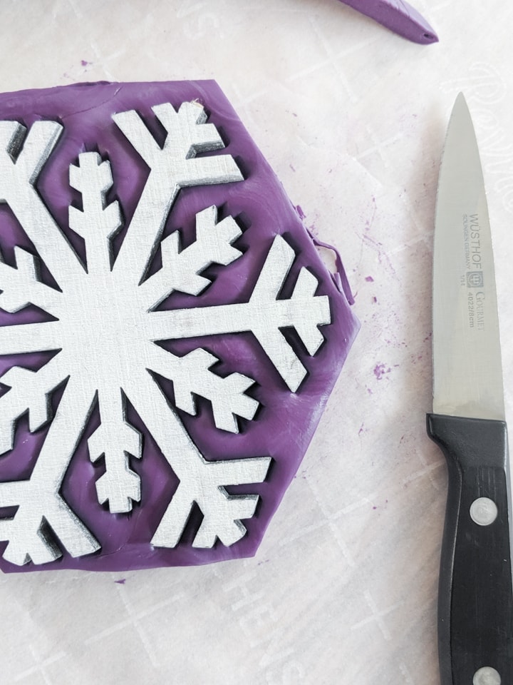 using putty to make a mold of a snowflake shape