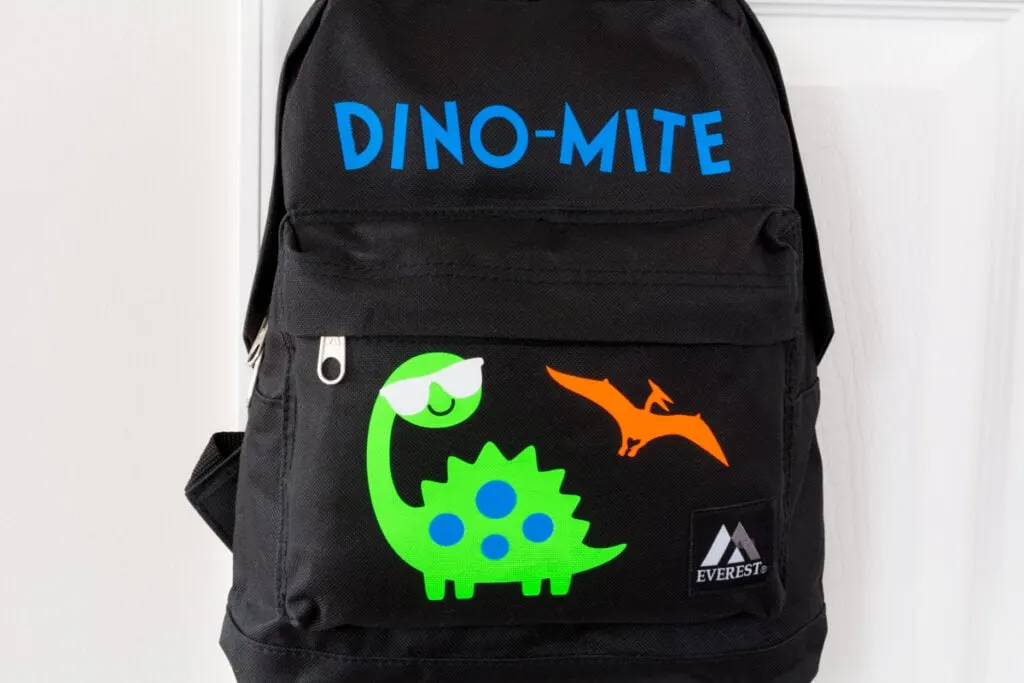 finished personalized backpack with dinosaurs on it