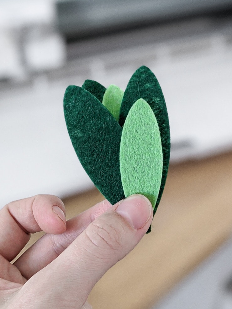 Gluing the felt pieces together to make a faux plant for a dollhouse