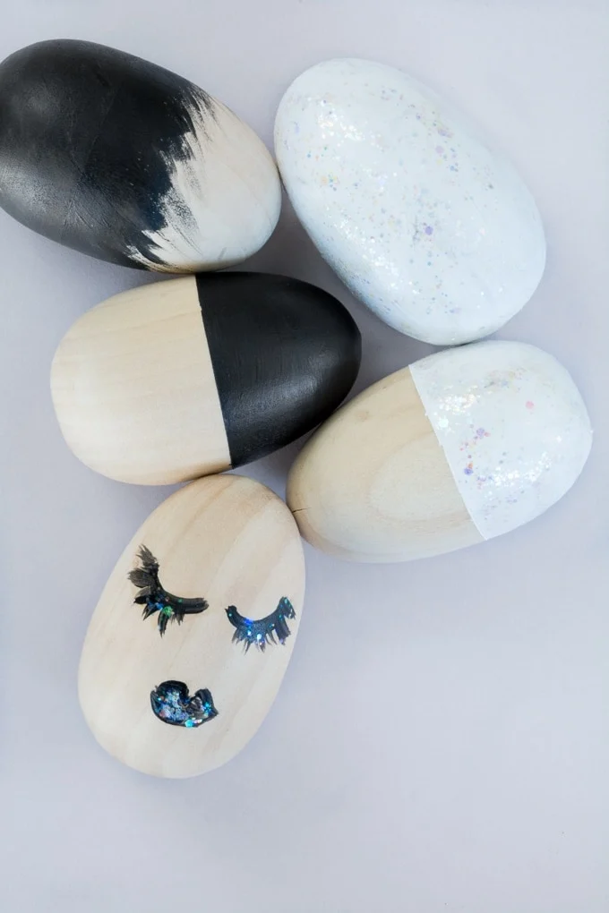 modern painted easter eggs laying on a table
