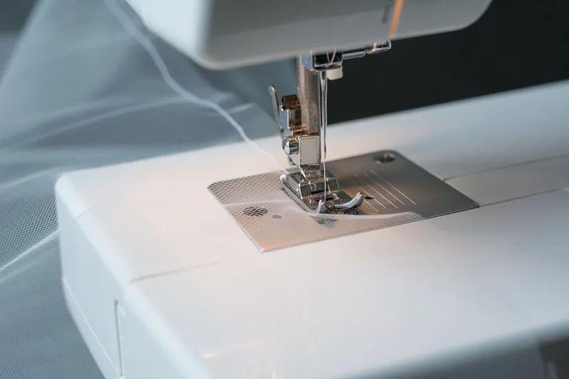 Sewing machine sewing a bridal veil