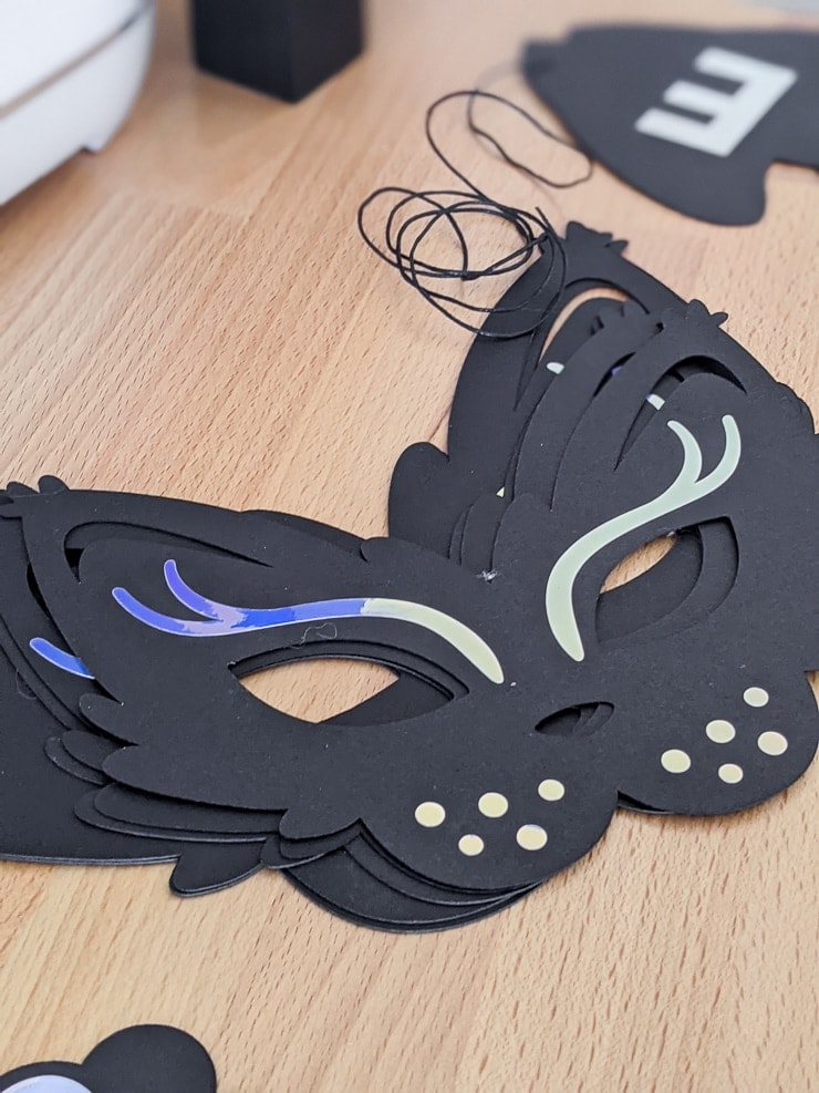 adding holographic vinyl to the DIY cat party mask
