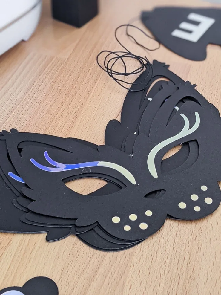 adding holographic vinyl to the DIY cat party mask
