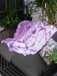 shibori blankets on an outdoor patio