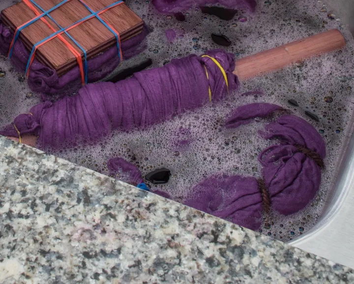 prepping a muslin blanket for Arashi shibori dyeing
