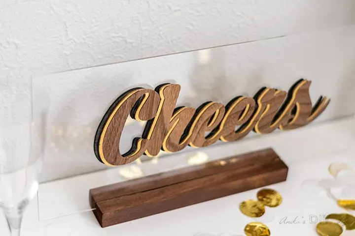 wooden 3-D cheers sign made using a Cricut Maker knife blade