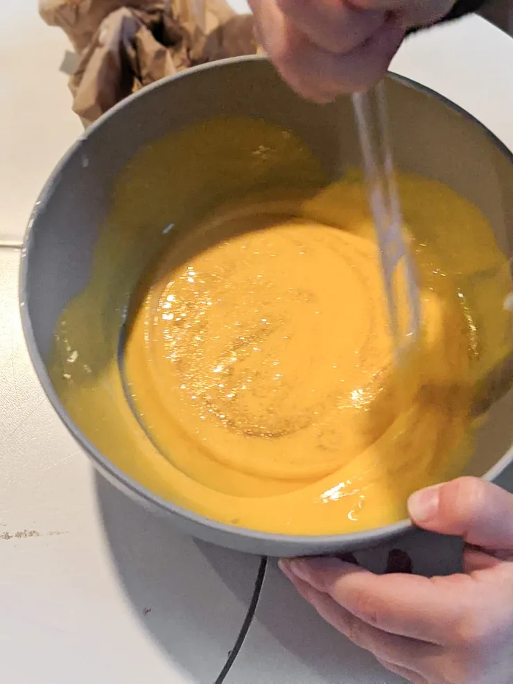 mixing DIY slime ingredients