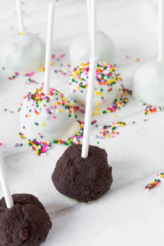 brownie cake pops with white chocolate and rainbow funfetti sprinkles