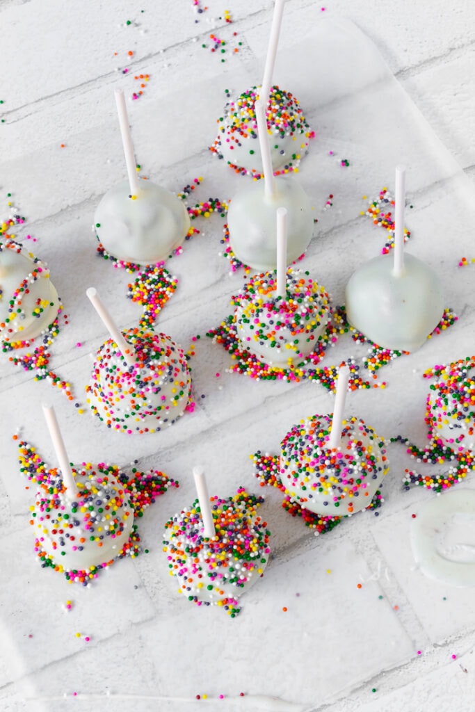 brownie cake pops with white chocolate and rainbow funfetti sprinkles