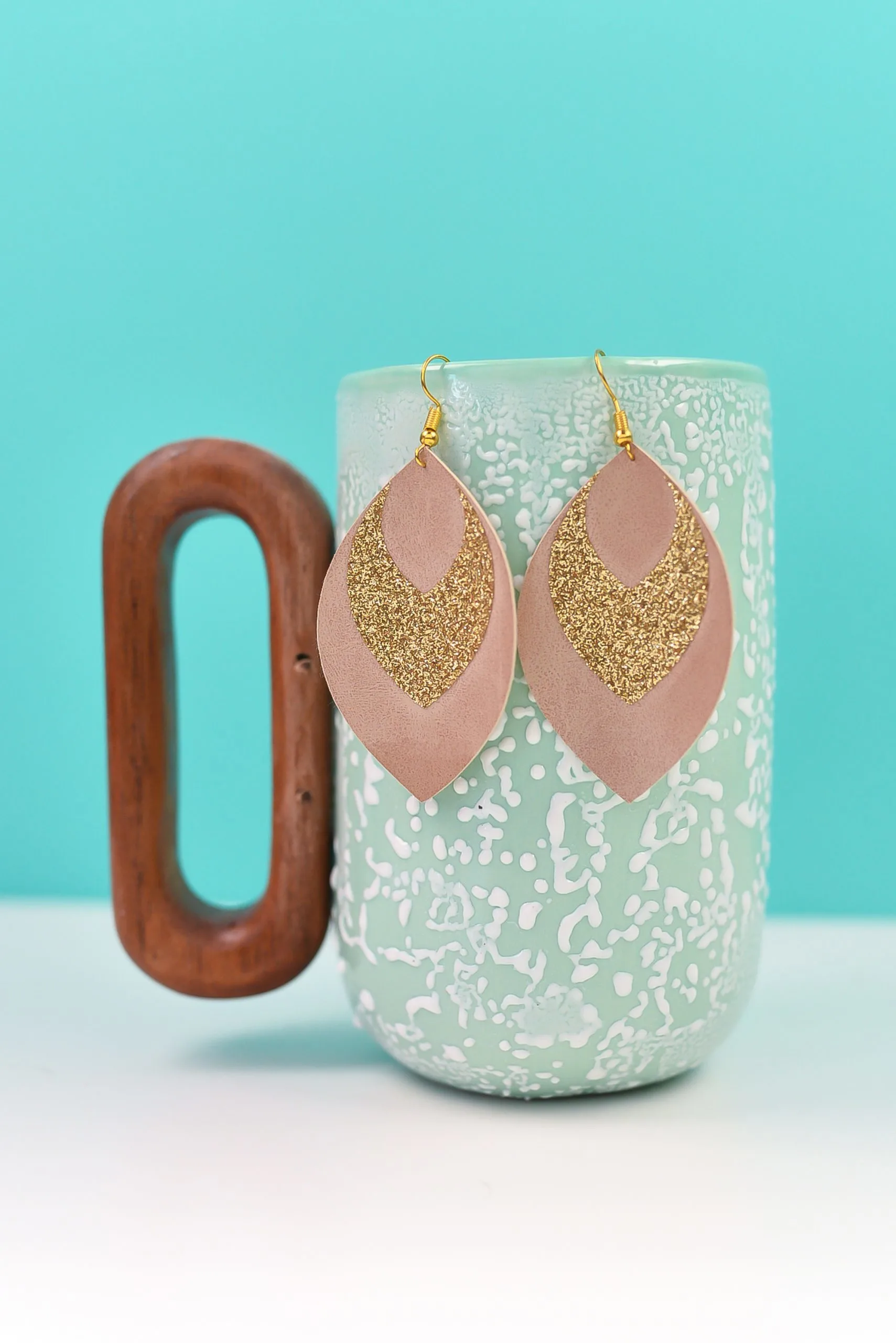 leather earring with glitter made with a Cricut