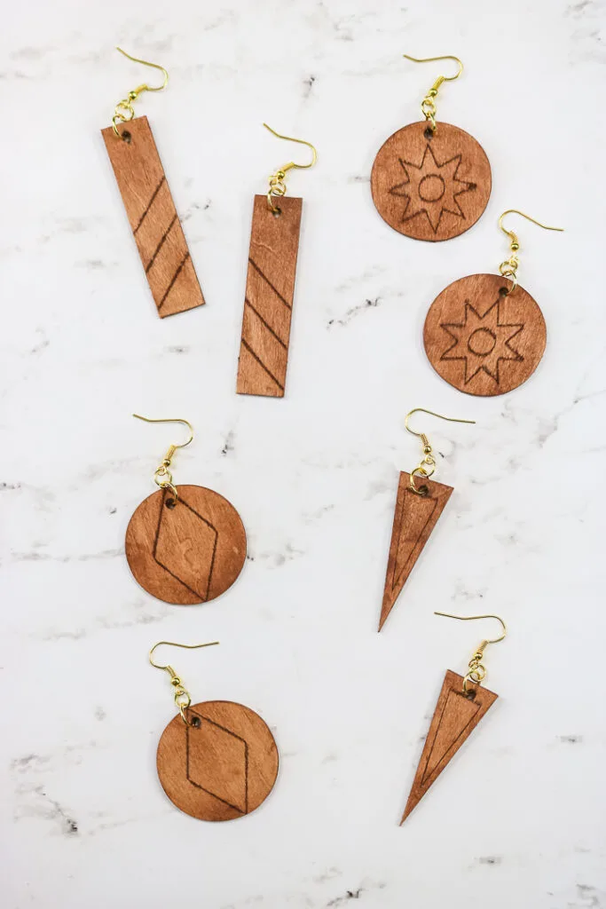 wooden earrings made and engraved with Cricut