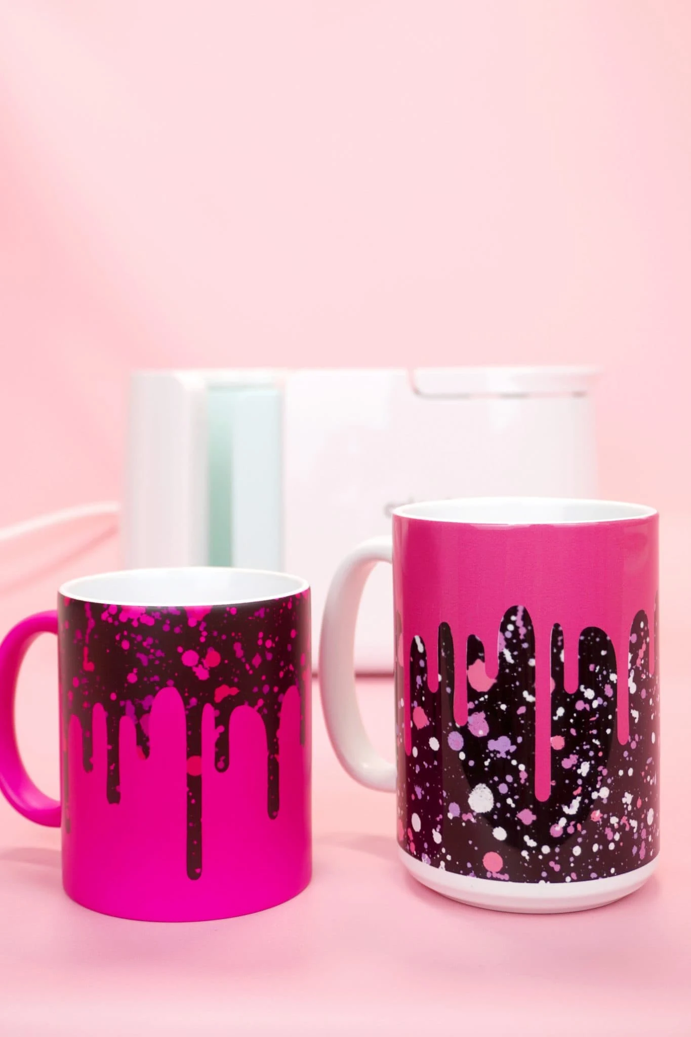 fushia color mugs with drippy design