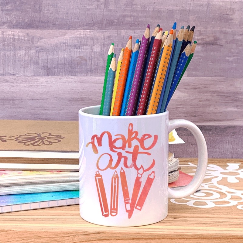 mug with colored pencils that say Make Art