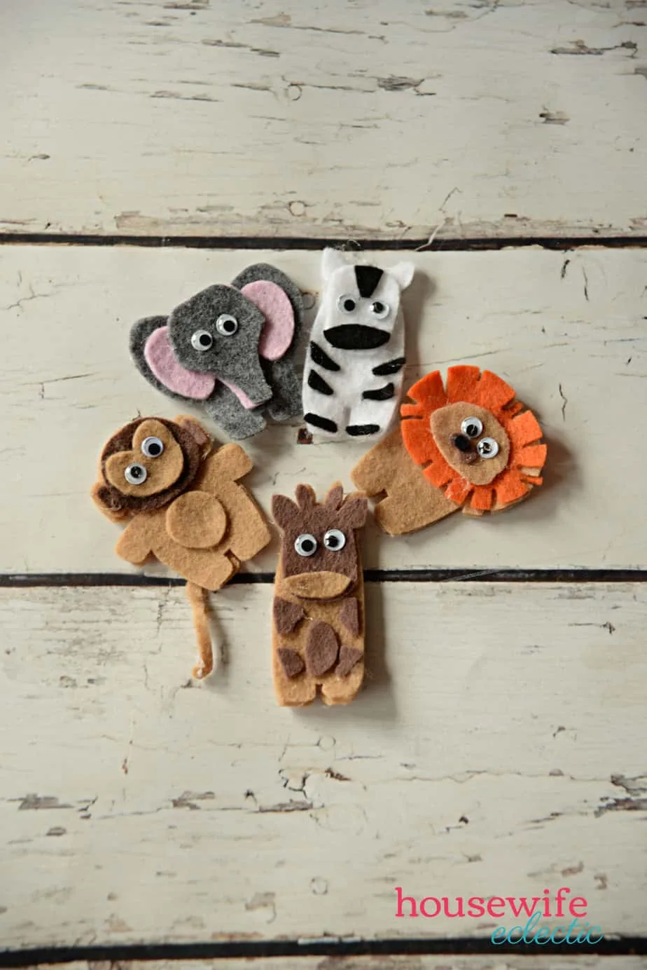 monkey, elephant, zebra, giraffe, and lion finger puppets made from felt on a Cricut