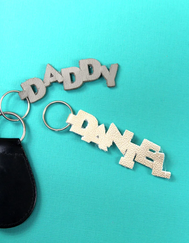 keychains made from leather spelling daddy and daniel