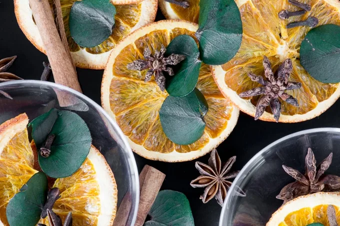 plastic ornament shell and dried orange slices with eucalyptus leaves and star anise