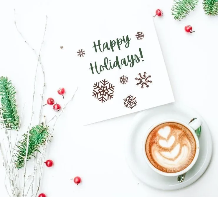 mock up image showing the snowflake svg files on a piece of paper that says happy holidays