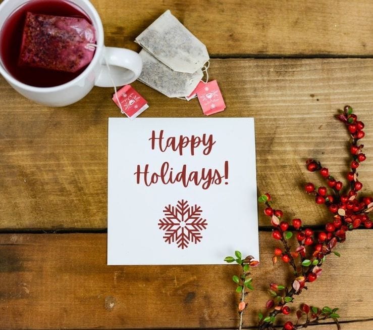mock up image showing the snowflake svg files on a piece of paper that says happy holidays