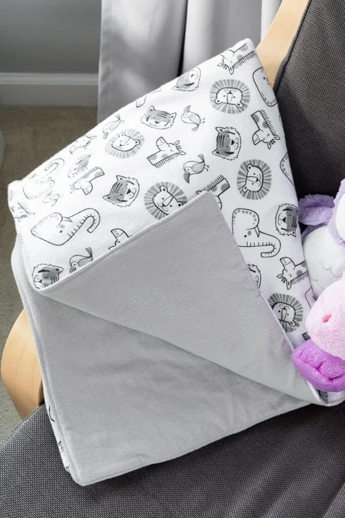 easy double-sided baby blanket sewing project on a rocking chair with stuffed animals