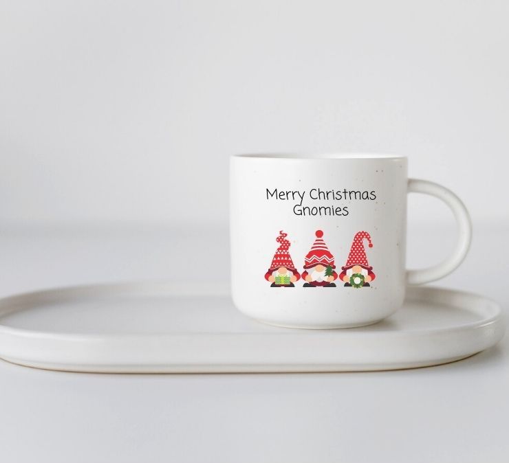 white coffee mug with the text Merry Christmas Gnomies