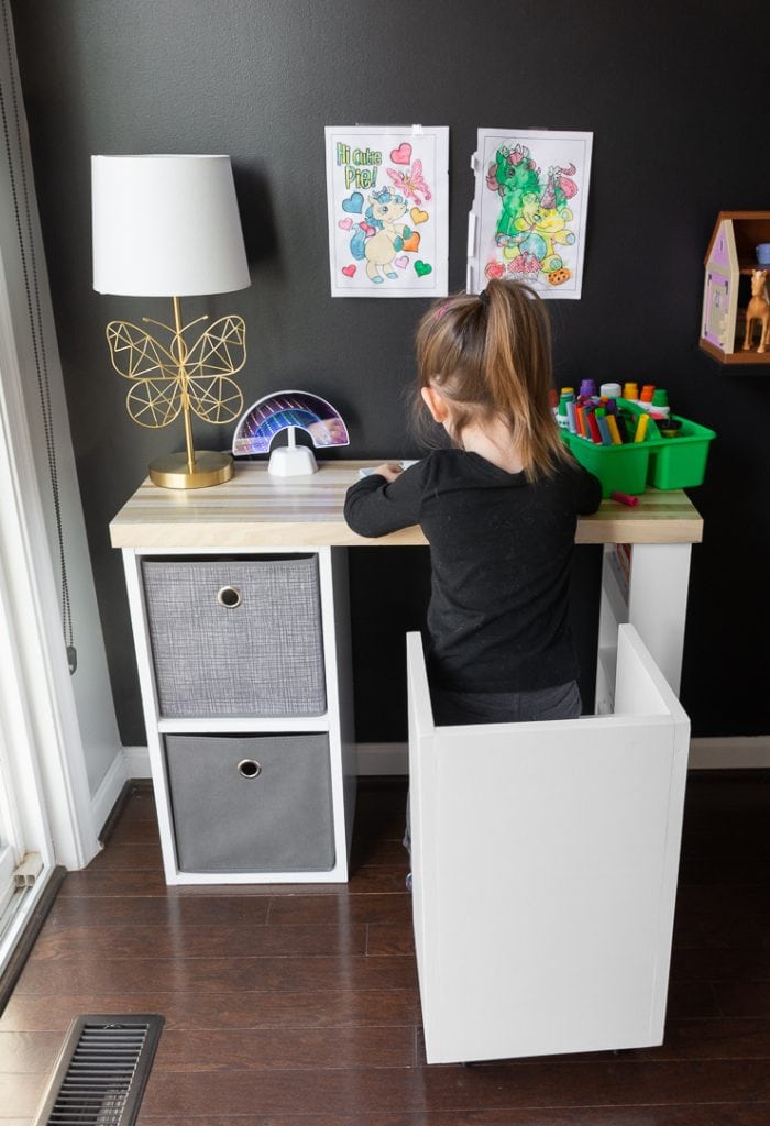 little girl coloring at a DIY kids desk