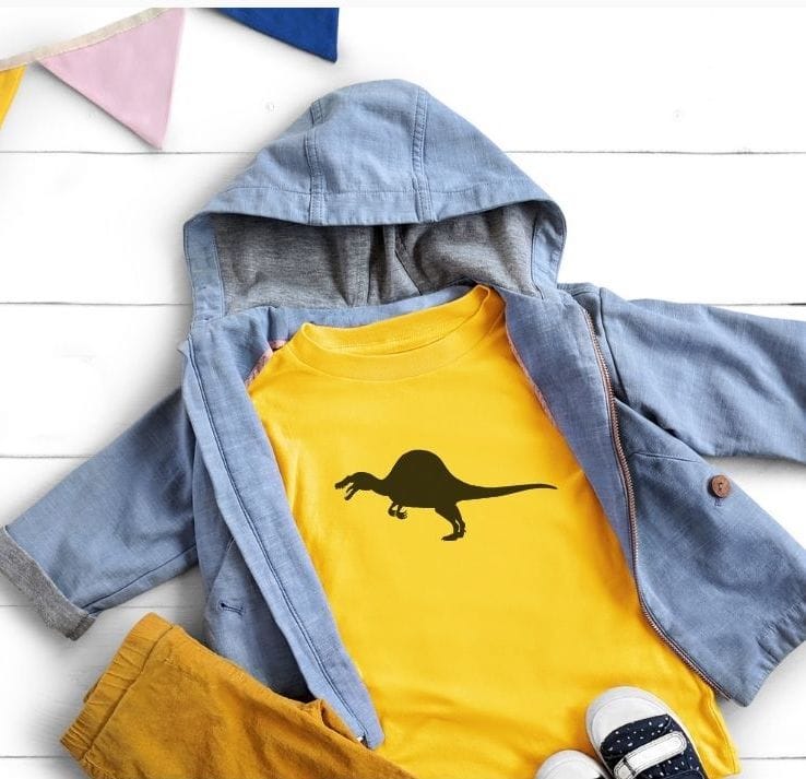 yellow shirt with a dinosaur on it and a jean jacket